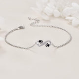 Pulsera con el símbolo del infinito, con un colgante con forma de huella y circonitas