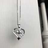 Collar con forma de corazón y pata de perro de acero inoxidable