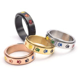 Anillo antiestrés giratorio con patitas – Anillo de acero inoxidable con colores del arcoíris