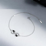 Pulsera con el símbolo del infinito, con un colgante con forma de huella y circonitas